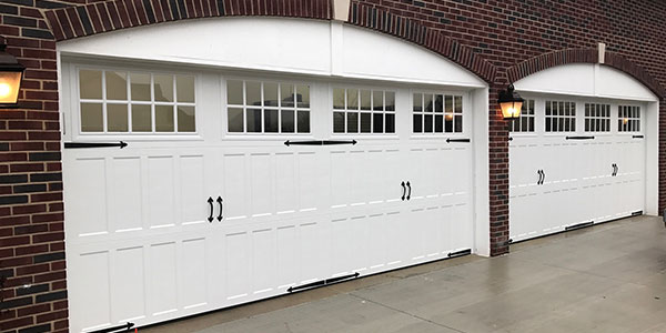 White garage door with carriage styles.