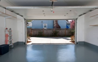 Picture of clean garage with door open.