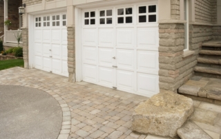 Right side of the double garage in the front of the stone house.